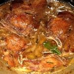 Braised Old Black pork chops with apple, fennel, and onions