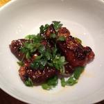 Sweet, spicy, sticky, Asian wings with cilantro and peanuts